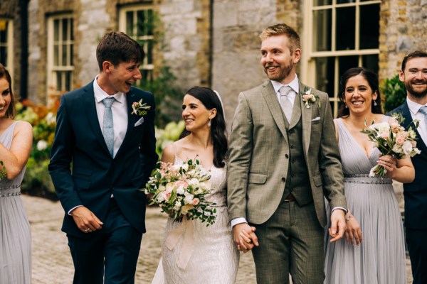 Brother groom and bride they hold hands smiling