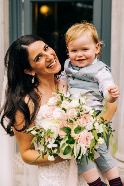 Mother and son in suit smiling for camera laughing