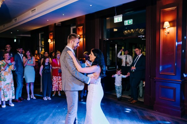 Bride and groom have their first dance on the dancefloor