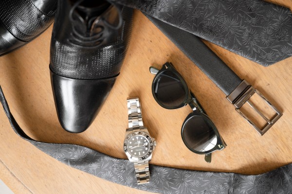 Black sunglasses watch man's belt and brogue shoes