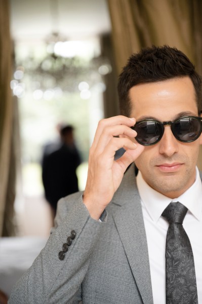 Groom wearing black sunglasses