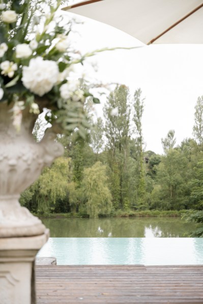 Fountain water pool statue white roses flowers garden setting