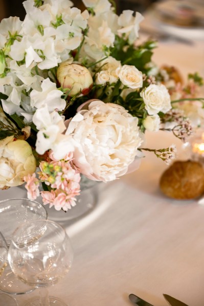 White flowers bouquet on table and glasses