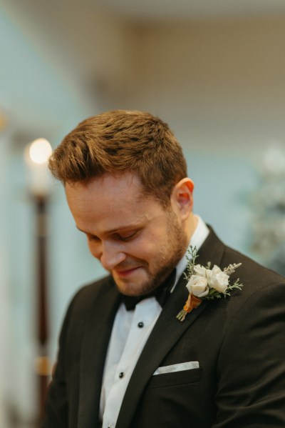 Groom awaits the bride in church