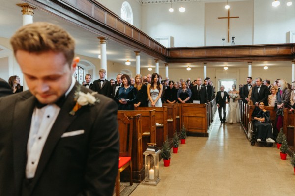 Father of the bride walks daughter down the aisle groom at alter