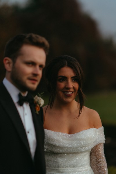 Bride and groom dark moody shot in garden