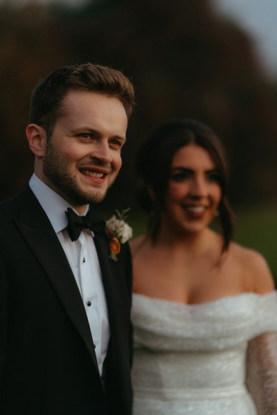 Bride and groom dark moody shot in garden