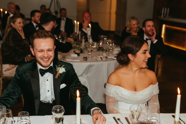 Red carpet leads up to wedding venue bride and groom