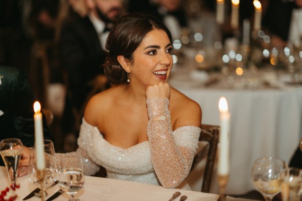 Bride laughs at table smiles