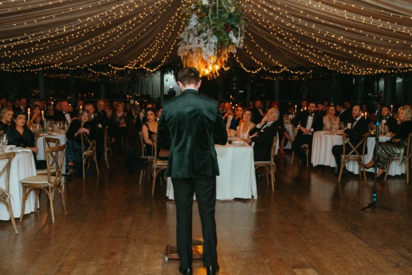 Groom gives speech to audience guests