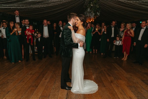 Bride and groom dance on the dancefloor together