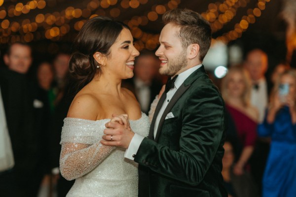 Bride and groom dance on the dancefloor together