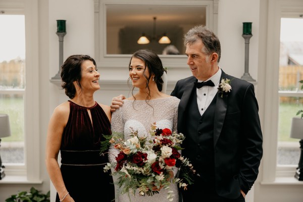 Mother and father proud of daughter emotional