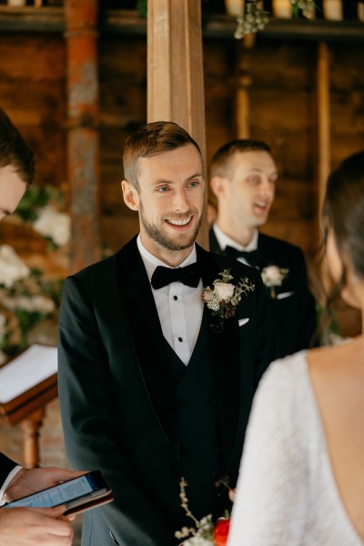 Focus on groom speaking to bride vows