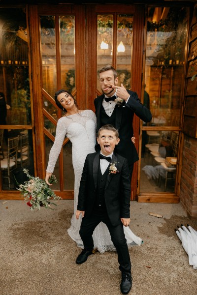 Funny face little boy bride and groom being silly pose for the camera