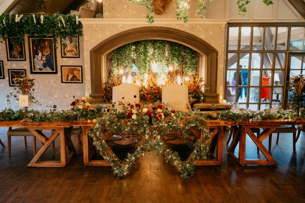 Candles lit at alter/top of room flowers on table