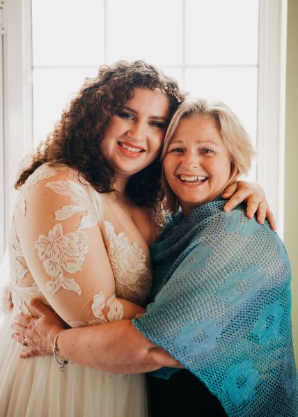 Bride and bridesmaid/friend pose together