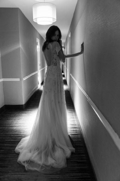 An Ode to Sophia: Bo & Luca Collection Sinatra gown black and white interior hotel corridor shot