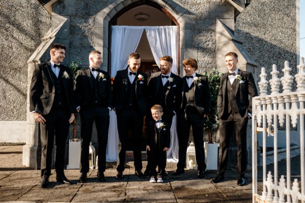 Groom groomsmen best man and little boy