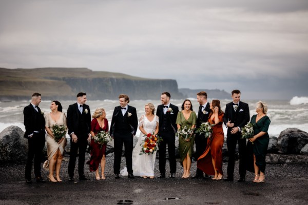 Bride groom groomsmen best man bridesmaids in front of scenic sea Kerry mountains and clifftop