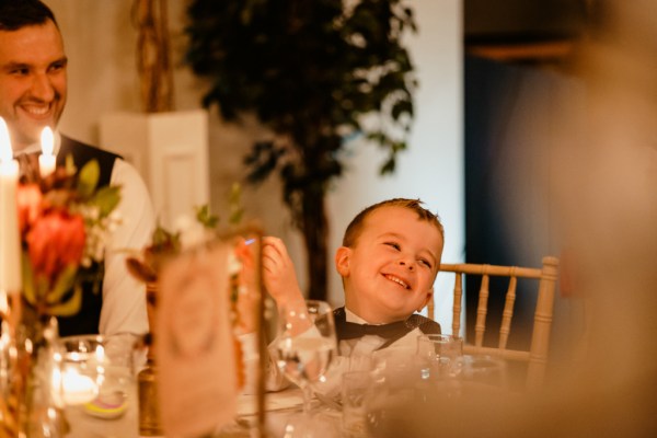 Little boy son is laughing at the table