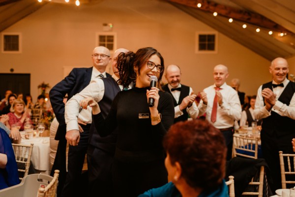 Woman singer sings into microphone music