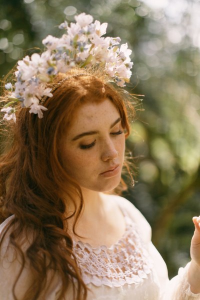 Model bride close up red head wearing floral flower headband