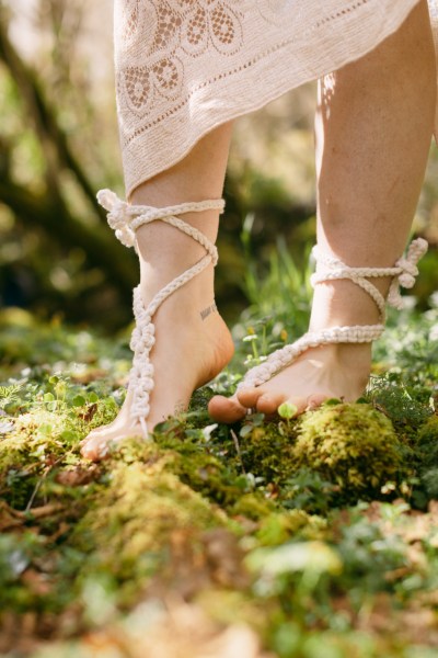 Close up of toes ribbon tied around legs