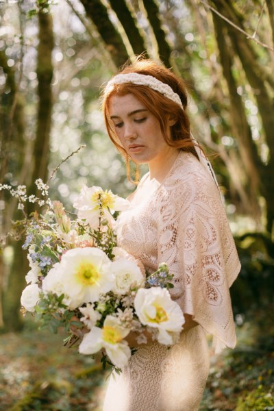 Close up of sunflower yellow white and bride wearing headband