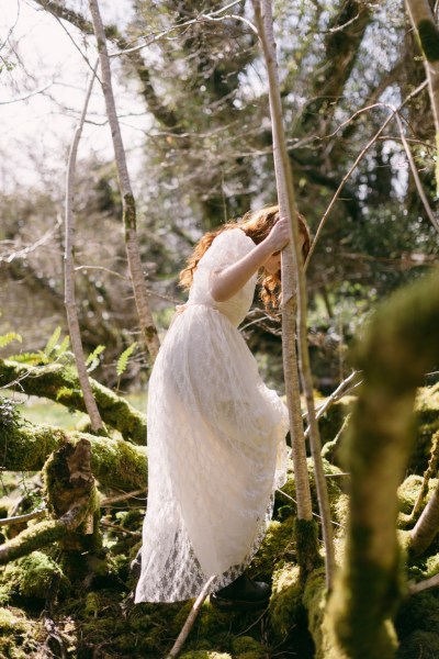 Model bride climbs trees setting bark