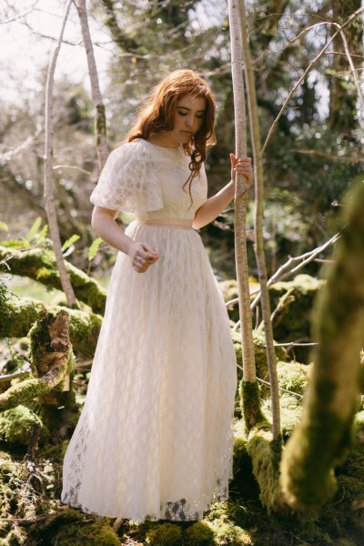 Model bride climbs trees setting bark