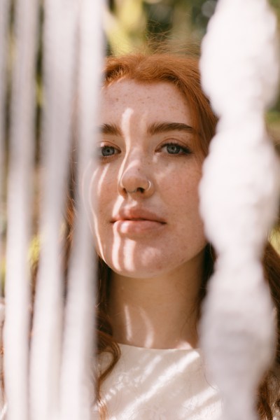 Model bride through string decor exterior forest setting