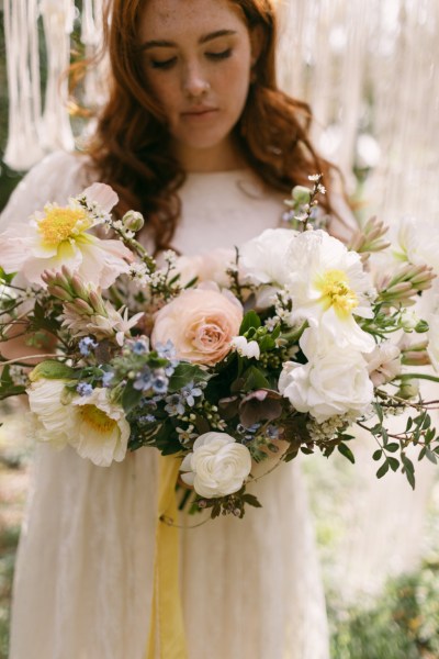 Close up white yellow sunflowers bride in background