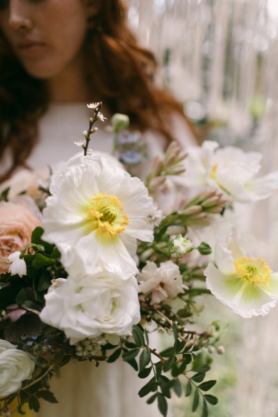 Close up white yellow sunflowers bride in background