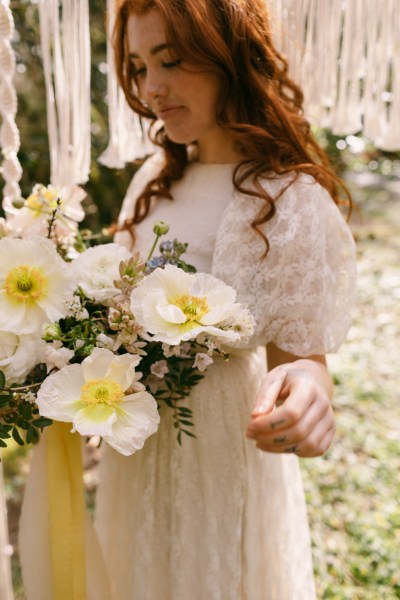 Close up of model brides hand tattoo sunflower yellow white