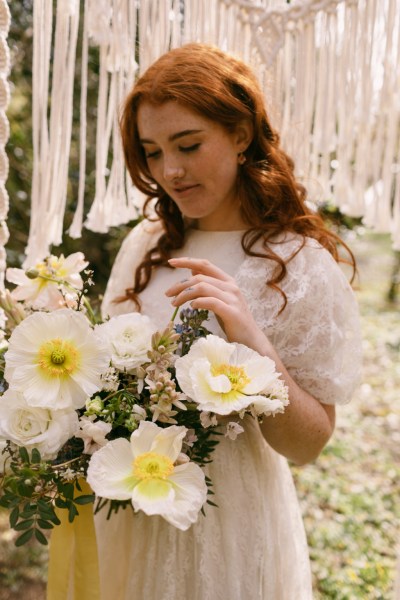 Close up of model brides hand tattoo sunflower yellow white