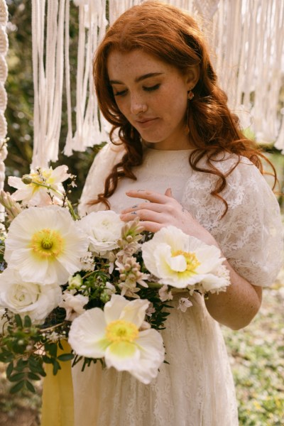 Close up of model brides hand tattoo sunflower yellow white