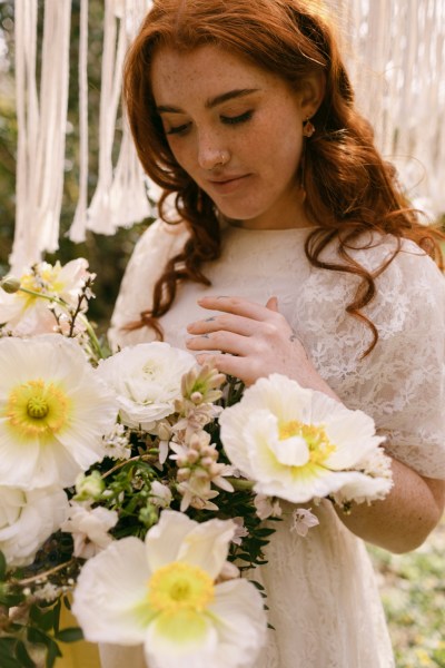 Close up of model brides hand tattoo sunflower yellow white