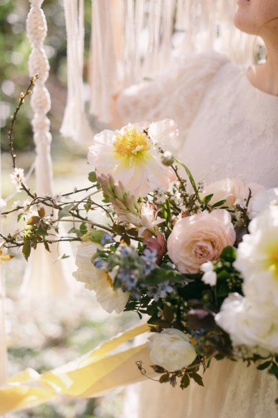 Close up of bouquet flowers sunflowers roses strings behind