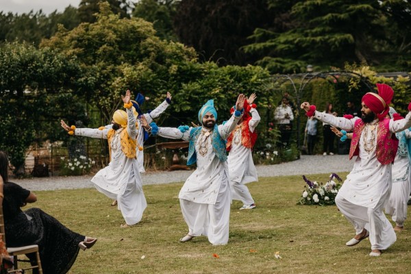 Dancers dancing on grass