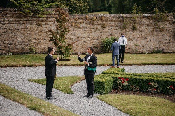 Grooms on pathway in garden