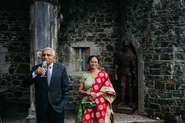 Mother and father smiling drinking champagne