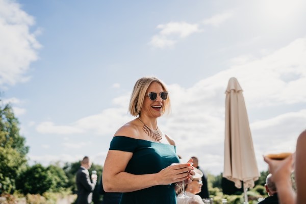 Woman with sunglasses smiling