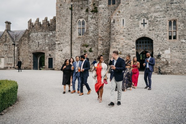 Guests outside castle venue hotel walking