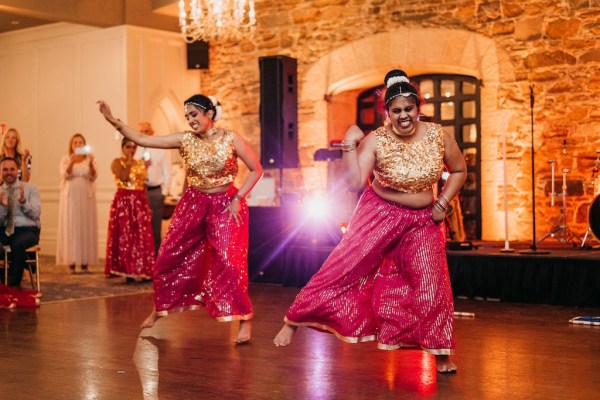 Dancers on dancefloor belly dancers pink gold attire