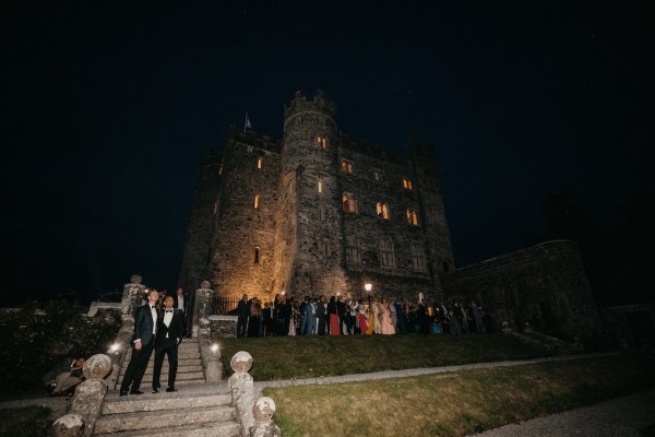 Firework display for guests grooms watching on steps