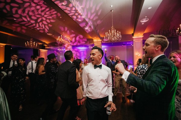 Groom on dancefloor with friends