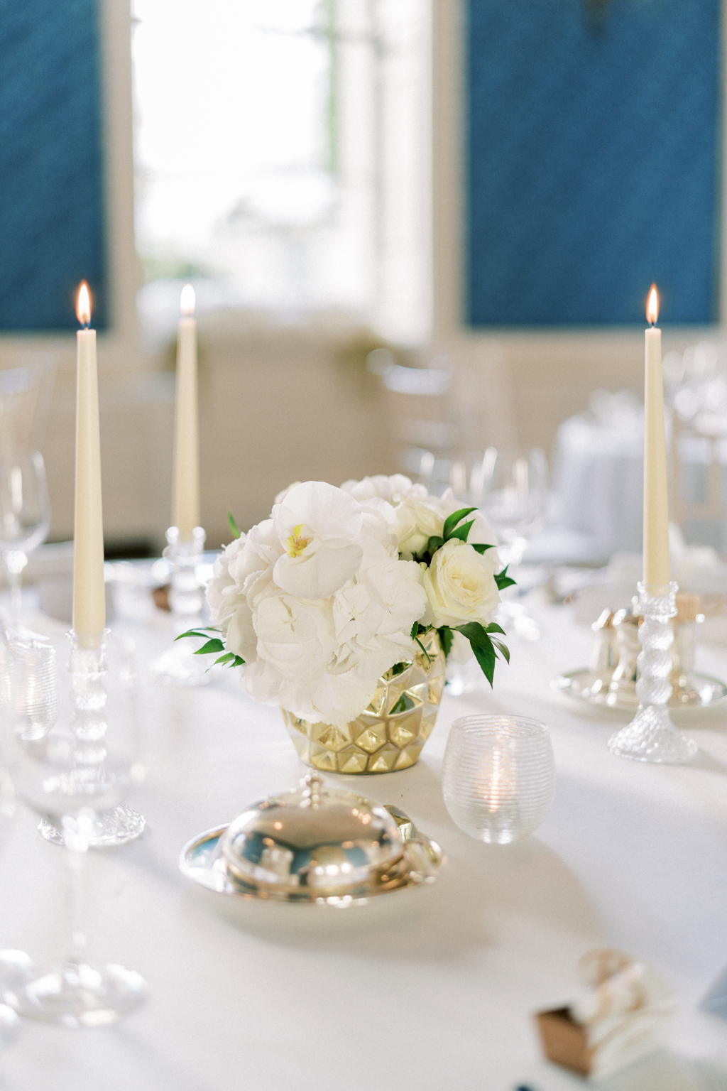 Table candles lit roses in basket