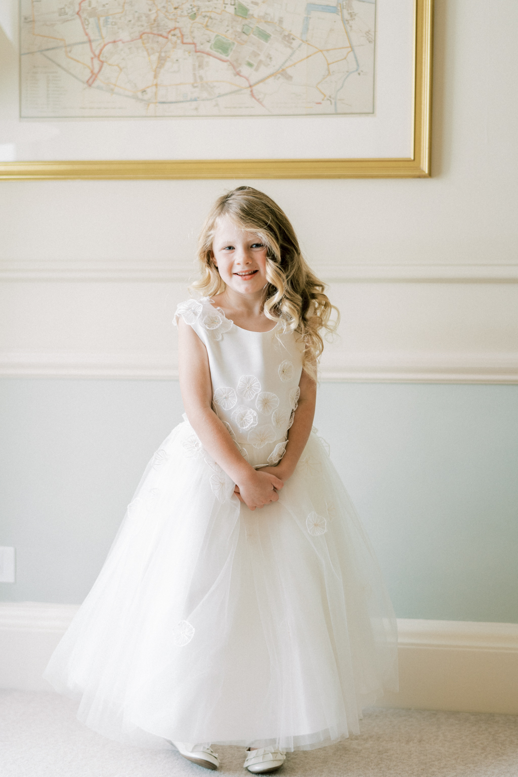 Little girl blonde hair poses for a picture