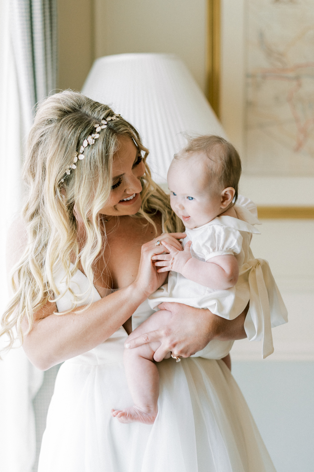 Mother and little baby girl smiling